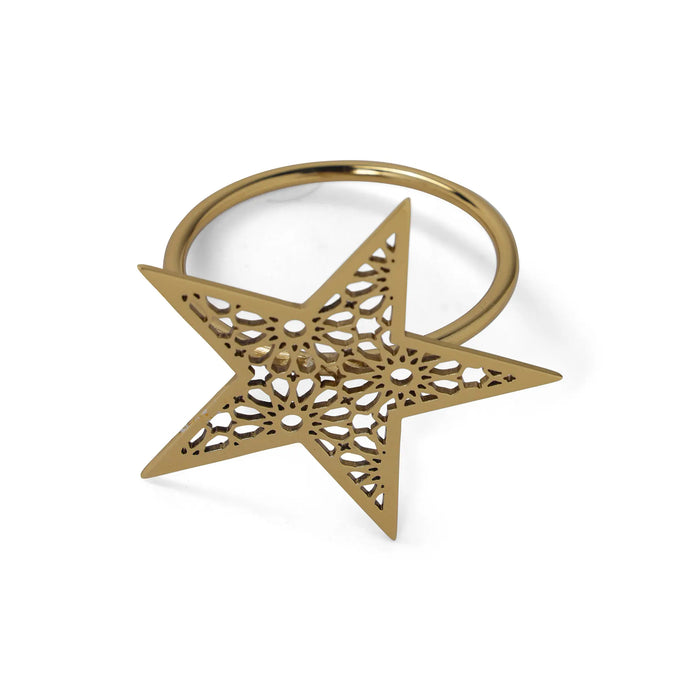 Gold star-shaped ring on a white background