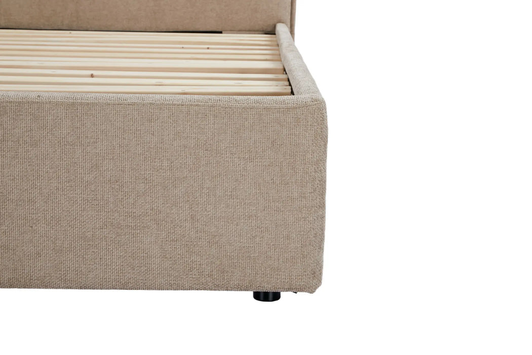 Beige upholstered bed frame with wooden slats on a white background