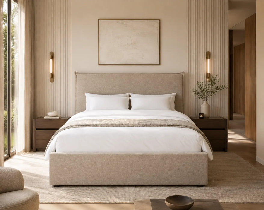 Neatly made bed in a modern bedroom with neutral tones