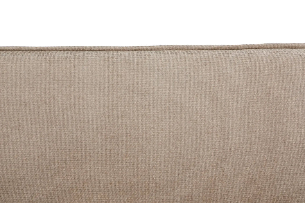 Close-up of a beige fabric surface with a subtle texture.