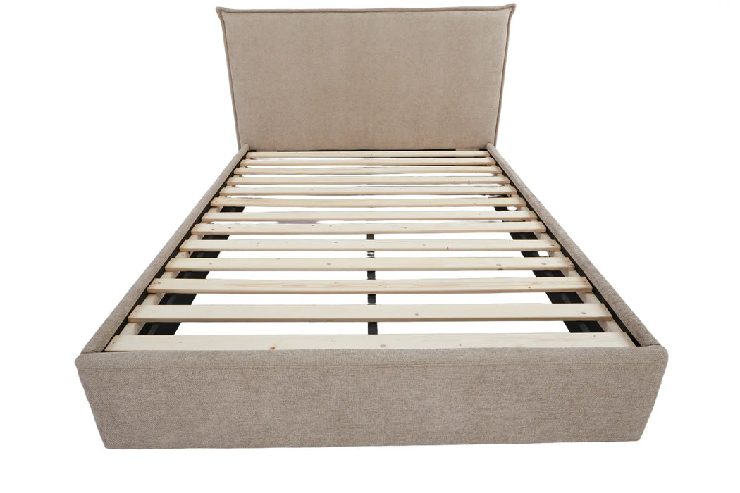 Beige upholstered bed frame with wooden slats on a white background