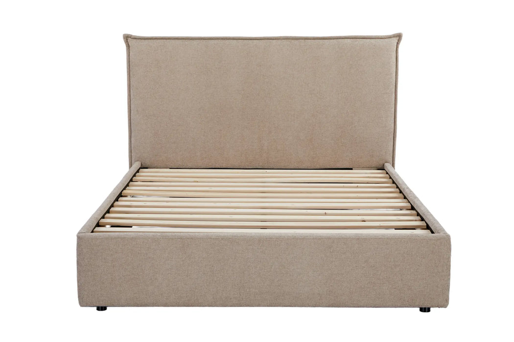 Beige upholstered bed with slatted base on a white background