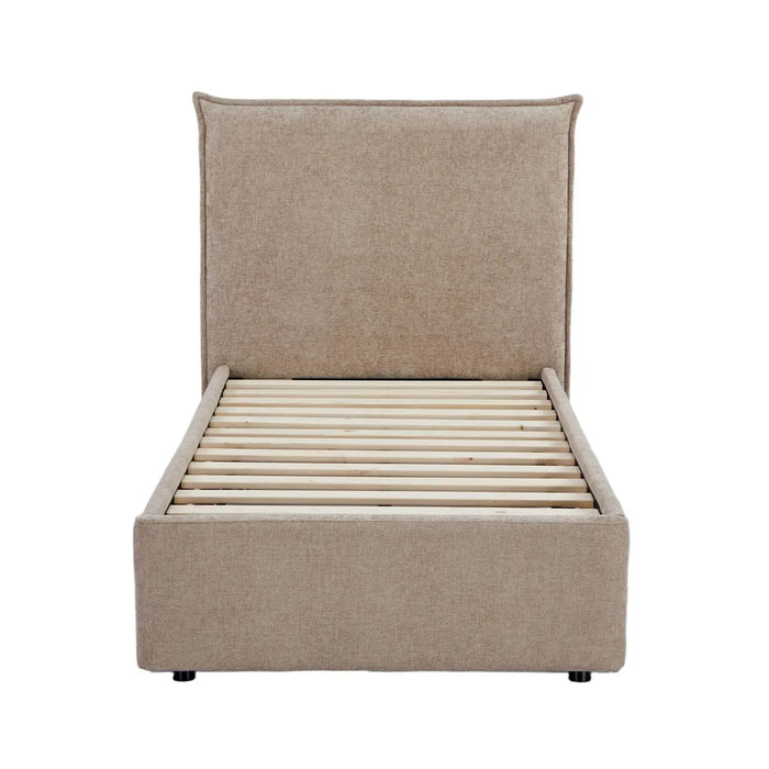 Beige upholstered bed frame on a white background