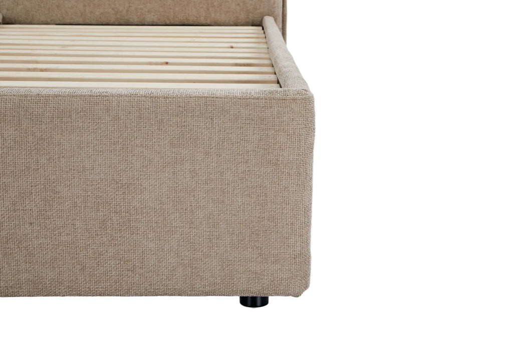 Beige upholstered bed frame with wooden slats on a white background