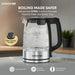 Krome electric kettle with boiling water on a kitchen counter, featuring safety features.