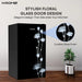 Black refrigerator with floral glass door design by Krome, featuring a plant on a wooden floor.