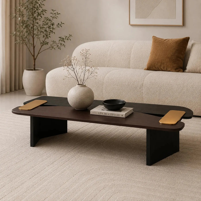 Modern living room with a dark wooden coffee table, beige sofa, and decorative items.