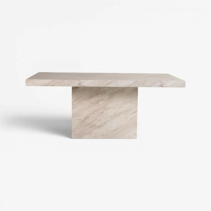 A modern rectangular console table with a thick, flat top and a single block pedestal base, both crafted from light beige marble with subtle cream and gray veining, shown against a plain white background.