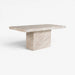A modern rectangular table made of light beige marble with natural veining, featuring a thick square pedestal base, shown on a clean white background.