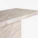 A close-up of a light beige marble tabletop with natural veining, shown against a clean white background.