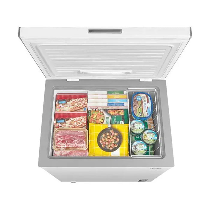 Open freezer with various food items inside on a white background