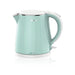Midea electric kettle with a light green body and white base on a white background