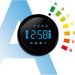 Digital clock with color-changing LED lights on a white background