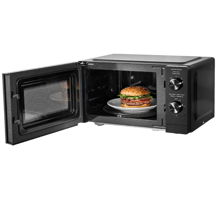 Black microwave oven with a burger inside on a white background