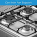 Gas stove with cast iron pan support on a blue background