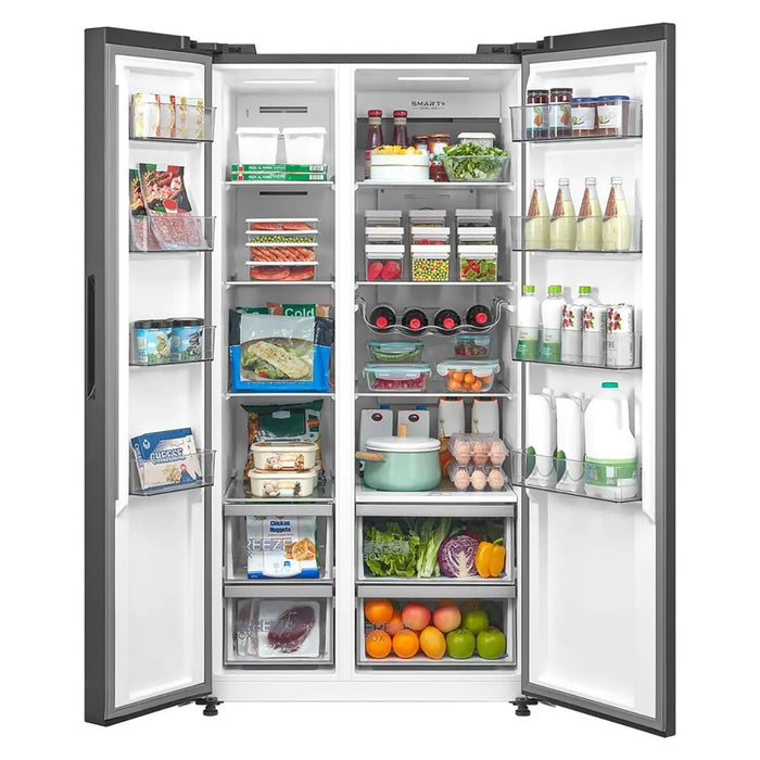 Open refrigerator with various food items inside on a white background