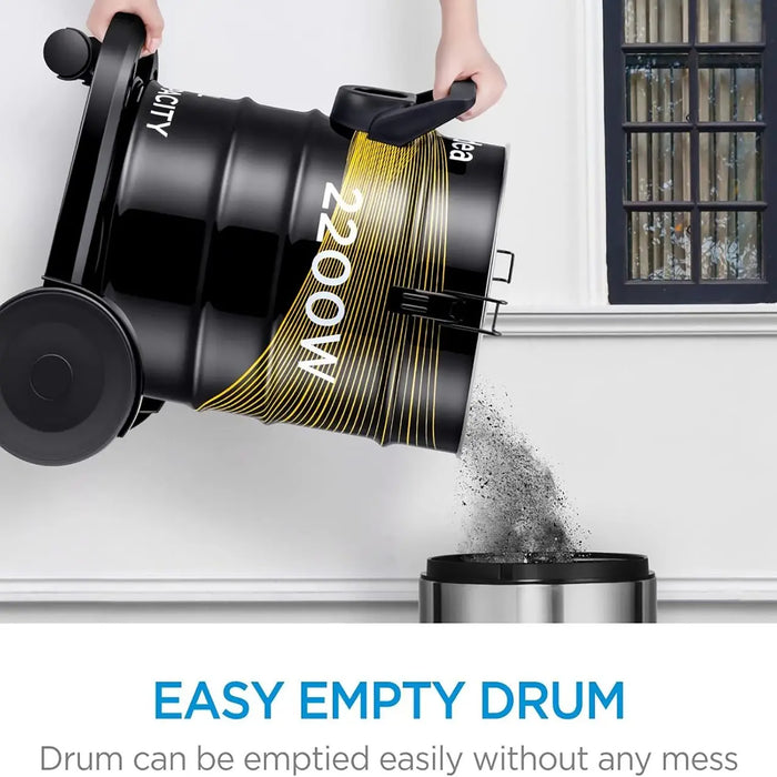 Black drum being emptied into a trash can with text 'EASY EMPTY DRUM' and '220W'.