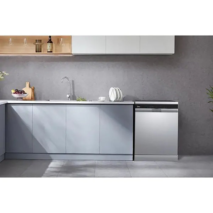 Modern kitchen with gray cabinets, white countertop, and stainless steel appliances.