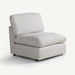 A modern upholstered accent chair with a low-profile base, square arms, and a thick, oversized cushioned back and seat, shown on a clean off-white background.