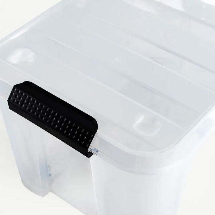 Clear plastic storage container with a black latch on a white background