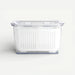 Clear plastic storage basket on a white background