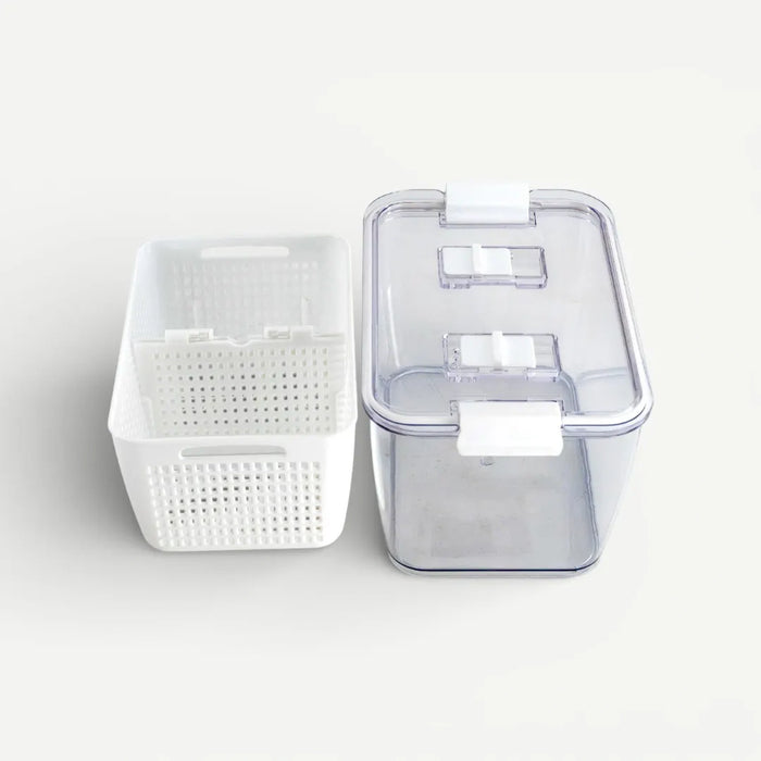 White storage basket and clear plastic container on a light gray background