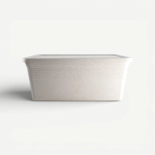 White woven basket on a light gray background