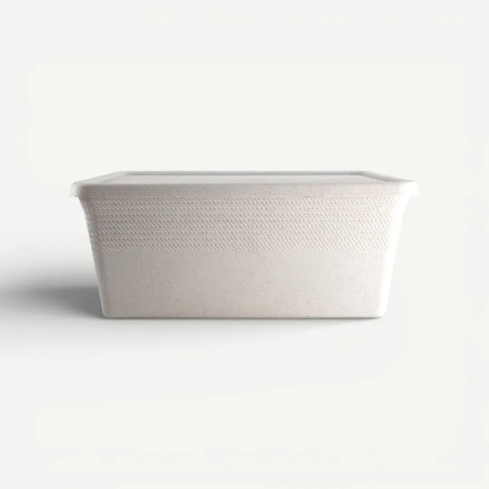 White woven basket on a light gray background