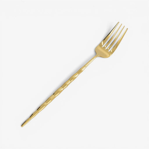 Gold fork on a white background
