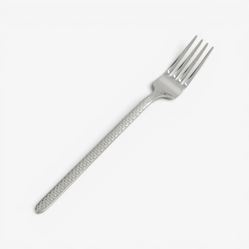 Silver fork with decorative handle on a white background