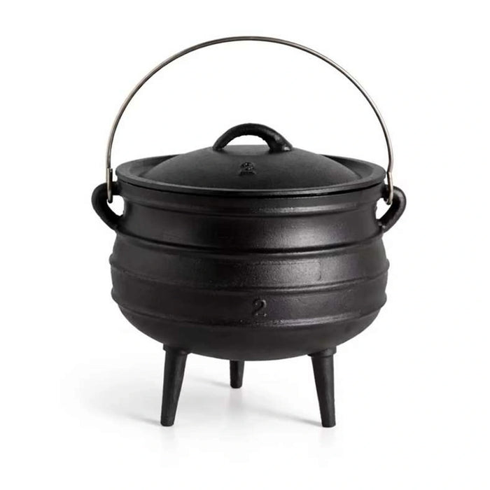 Black cast iron pot with lid on a white background