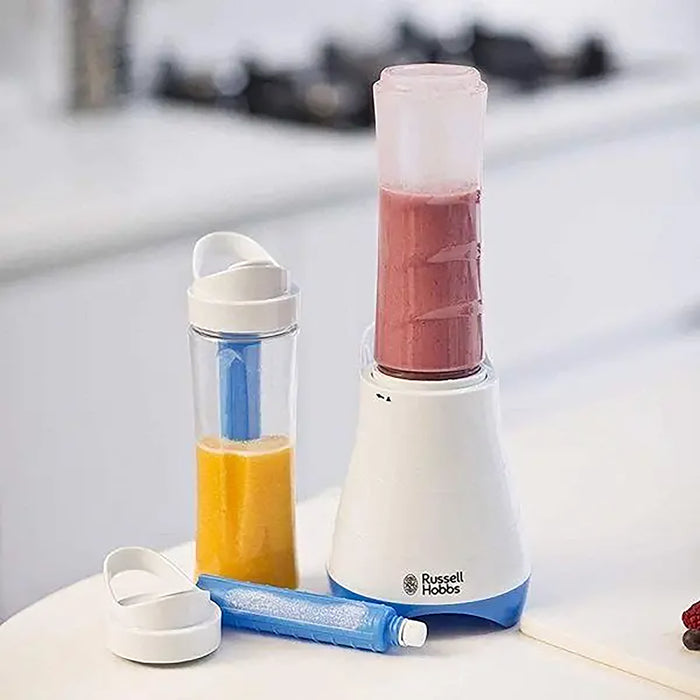 Russell Hobbs blender with a smoothie and a separate container on a kitchen counter.