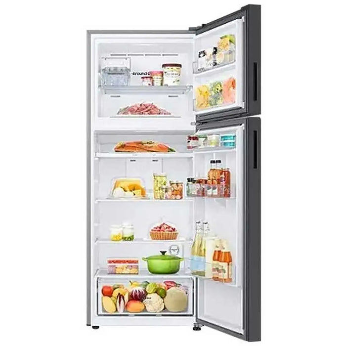 Open refrigerator with various food items on a white background