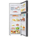 Open refrigerator with various food items on a white background