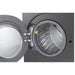 Open washing machine drum with a yellow detergent pod inside on a white background