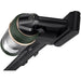 Close-up of a black and green vacuum cleaner head on a white background