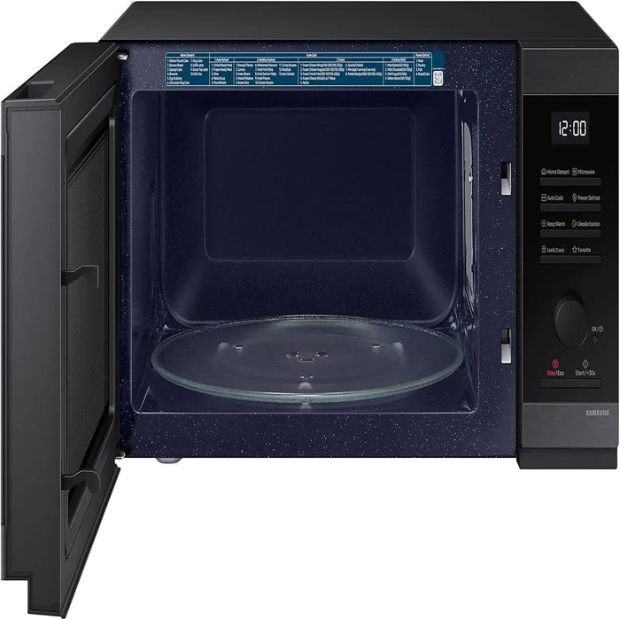 Black microwave oven with open door on a white background