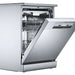 Stainless steel dishwasher with open door on a white background
