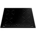 Black induction cooktop with four heating elements on a white background