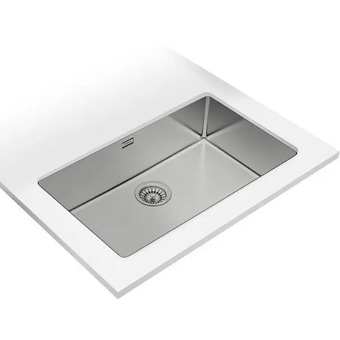 Stainless steel kitchen sink with white countertop
