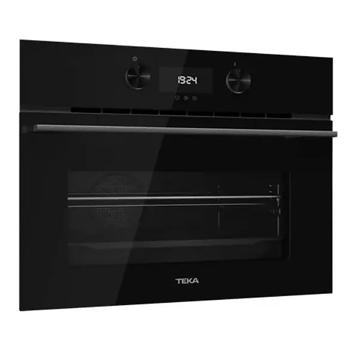 Black Teka oven with digital display on a white background