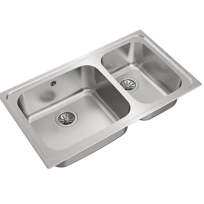 Stainless steel kitchen sink on a white background