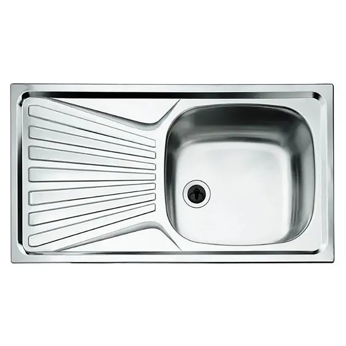 Stainless steel kitchen sink with drainboard on a white background