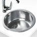 Stainless steel kitchen sink with faucet on a white background