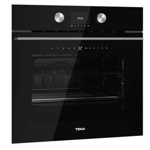 Black Teka oven with digital display on a white background