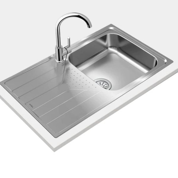 Stainless steel kitchen sink with faucet on a white background
