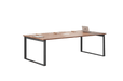 Wooden desk with metal legs on a green background